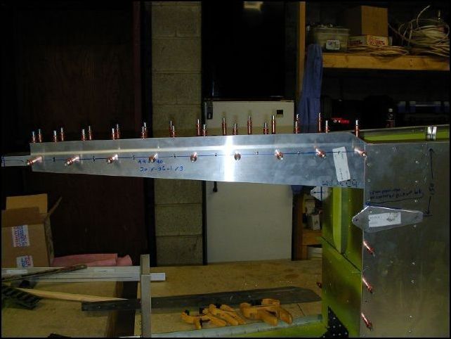 Drill and cleco the upper rear side skins A4 P40, do not drill at the HT frame at this time.  Drill the HT frame area AFTER the rudder is installed.