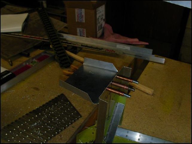 Position 20-F-26-5 (rear side skin stiffener) to the top of the rear fuselage panel (640-F-6-6).  Drill and cleco with two A4 clecoes.  I used three before I noticed that the drawings call for just two.  I don't think this will harm anything though.