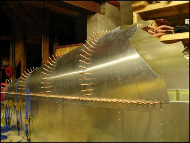 Measure down the top longerons 10 mm and 20 mm.  Mark a line along the top rear skins at both locations.  The mark at 10 mm is the rivet line and the mark at 20 mm is the trim line.  Yes, you have to trim the side skins so that they will fit the fuselage correctly.  Drill and cleco the rear top skins at the 10 mm line.