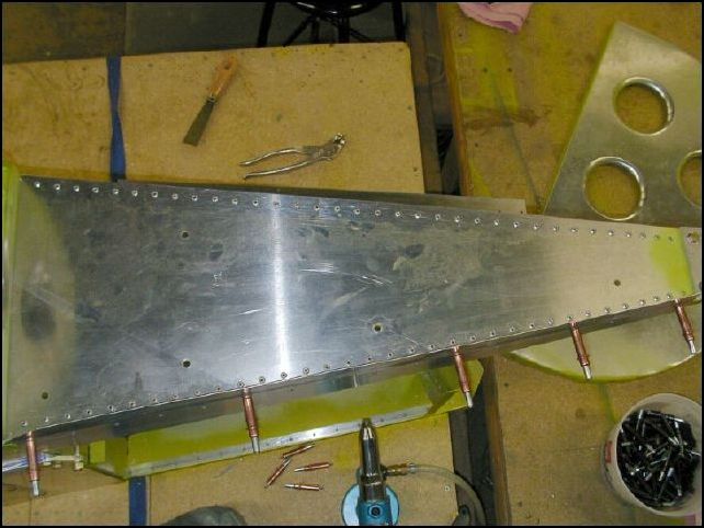 rivet top rear skin to top longerons