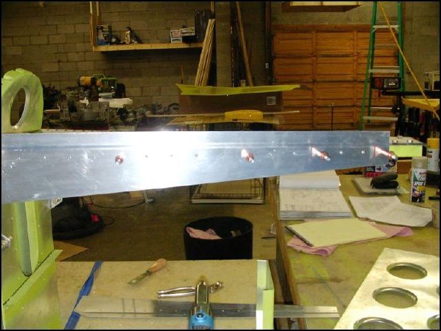 rivet rear top side skins to top longerons.