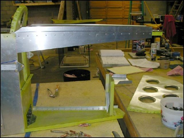 rivet rear top side skins to top longerons.