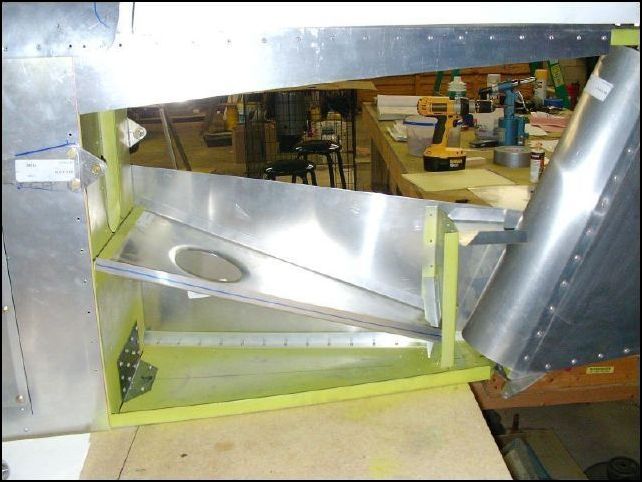 Position the diagonal tail panel to the fuselage and drill through the lower tail skin.  Cleco in place.  Be sure that the first 5 holes at the rear are A5 and the rest are A4.