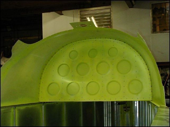 Rivet the cover to bulkhead 4.