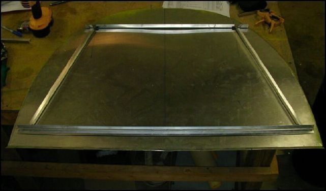 Remove bulkhead 3 and cut L's (640-F-40-12) as per drawing to lay out the baggage compartment cut-out.  The bottom L will be riveted to the same rivet line as the horizontal stiffener.  The drawings show the L on TOP of the stiffener, however I am putting mine under the stiffener so that I don't have a gap between the bulkhead and the L.