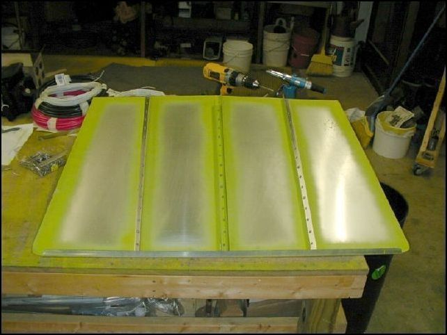 Rivet Ls to baggage floor but do not rivet at the back.  This way you can slide the flange of bulkhead 4 between the Ls and the floor skin.  The drawings show the skin under the flange of the bulkhead, but I want mine on top.  It just seems more solid that way.