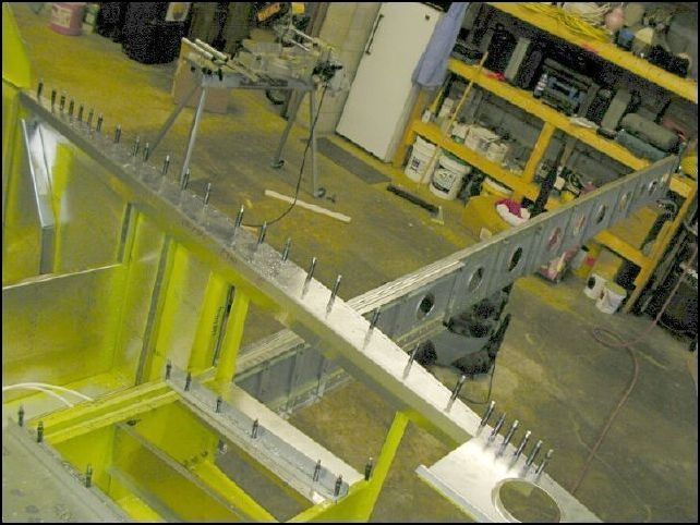 Drill and cleco the longeron doubler to the top longeron.  Make sure that you have the AN3 bolt holes at the front and rear in the correct locations.