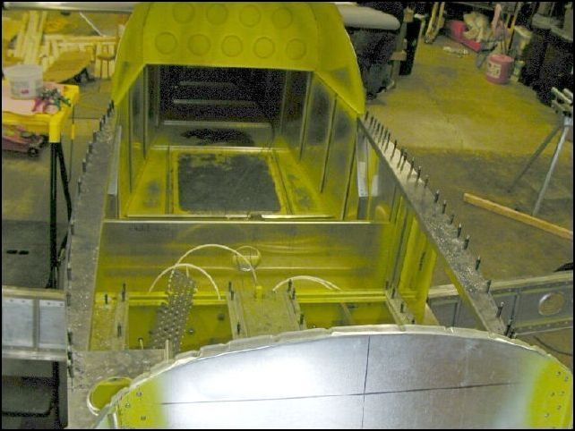 Another image showing the top longeron doublers clecoed to the longerons.