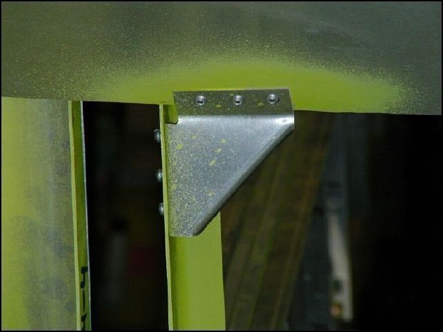 Drill, cleco, deburr, clean, prime, and rivet the armrest gussets as per drawings.