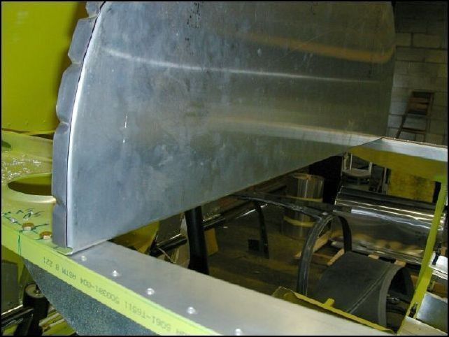 Position the instrument panel on top of the armrests and under the front horizontal panels.