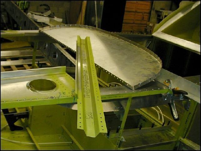 Remove clecoes, deburr, clean, and prime.