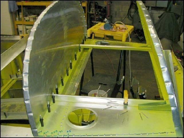 Rivet the under instrument panel at the front to the front horizontal panel.  DO NOT RIVET THE INSTRUMENT PANEL at this time.  I guess you could rivet the instrument panel, but it will be easier to be able to remove it when you cut your instrument holes.  I am not going to use this as my instrument panel.  Instead I am going to cut LARGE openings in this part and then install rivnuts around it and create an instrument panel that will then screw to this panel.  By doing this I will be able to remove my instrument panel any time I want to work on it just by removing a few screws.  This was a leason learned from my CH-300.