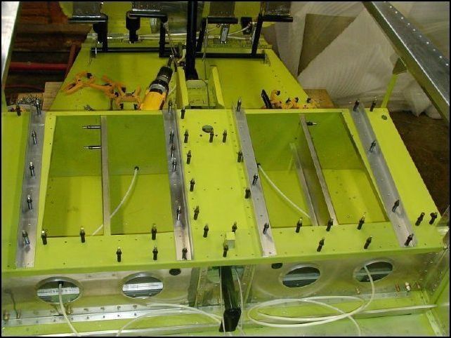 Front seat channel parts ready to be riveted