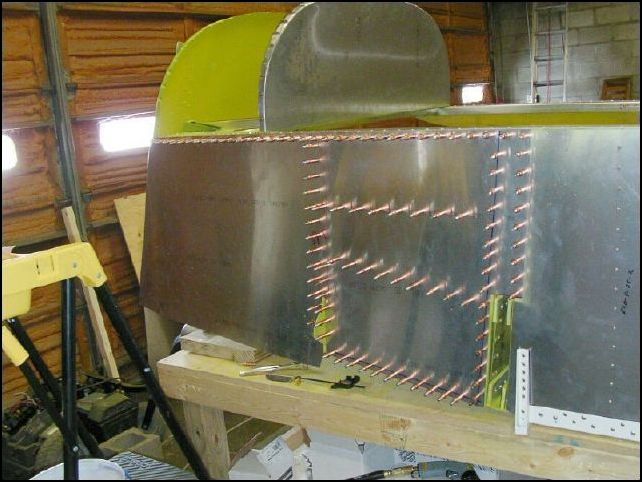 Fit front lower skins to the fuselage.  Drill and cleco top and rear of skin.