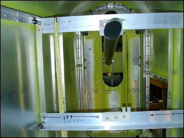 Position the horizontal tail stops to the fuselage.  You can drill and cleco the top one in place, but clamp the bottom one and position it for the proper deflection.  Then drill and cleco in place.