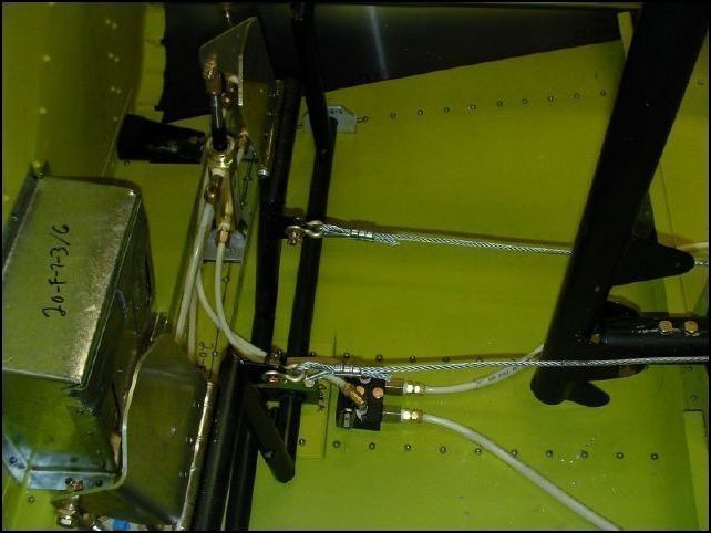 Nicopress the rudder cable ends and bolt to the rudder pedals.