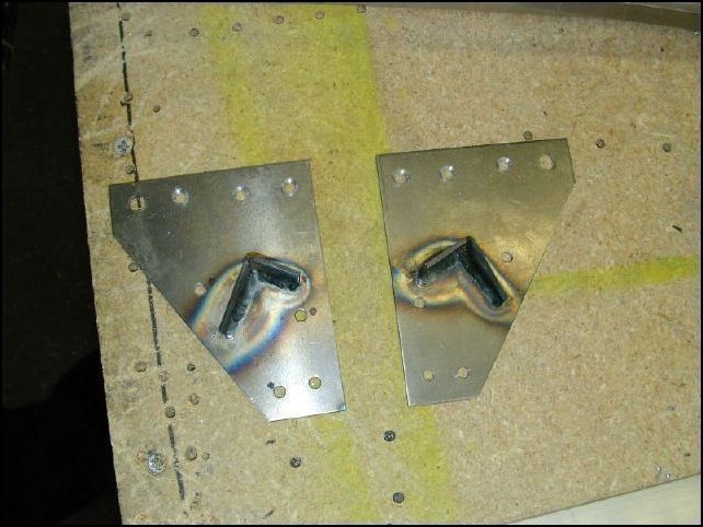 Drill 7 AN5 rivet holes in the front seat back supports.  I drilled the rear holes as flush mount holes so that the seat back will not hit them.  Again, this is not how the drawings show them.