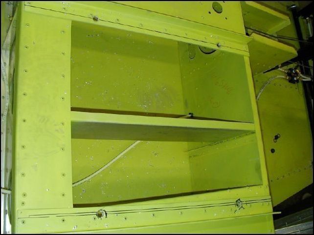 Drill holes in the seat rails on the fuselage to bolt the seat slides in position.