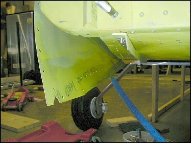 Remove clecos and strap.  Deburr, clean, and prime.