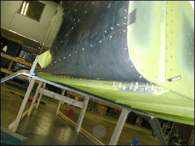 Stap front skin back in place, cleco and then rivet.  I used A5 SS rivets in the firewall area.