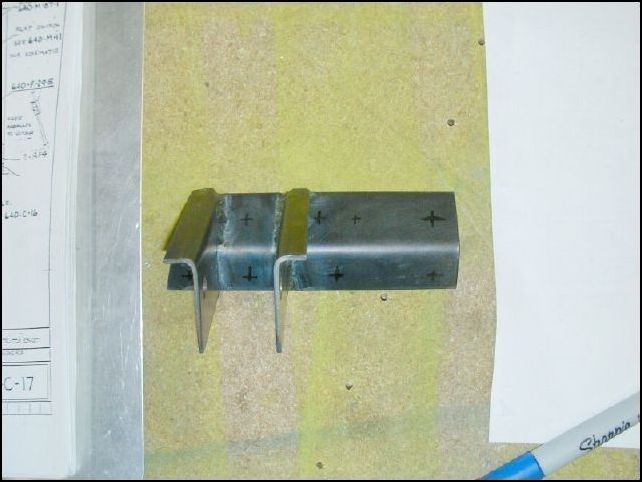 Mark and drill rivet hole locations in the flap motor bracket.