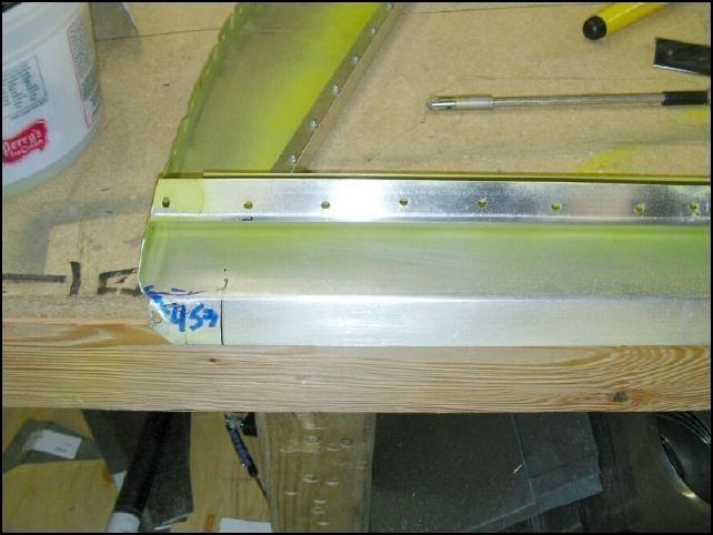 Remove bulkhead 3 and mark 45 MM from the left side (pilots side).  This is the location of the flap motor bracket.