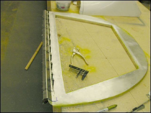 Remove bulkhead 3 again and clamp the rear seat top Z to the bulkhead.  Drill two rivet lines A5 P40.