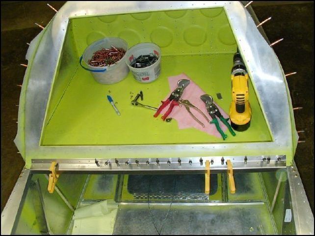 Cleco bulkhead 3 to the fuselage AGAIN.  Drill through the rear seat top Z rivet holes into the baggage floor.