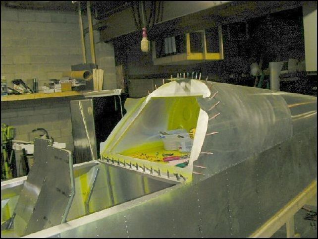 Image showing bulkhead 3 with rear seat top Z and flap motor bracket clecoed in place.  This image does not show the flap motor bracket, but it is there, behind bulkhead 3 and 45 mm from the left side.