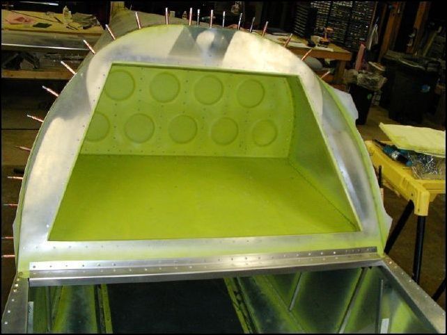 Remove clecoes from front of bulkhead 3.  Deburr and rivet.