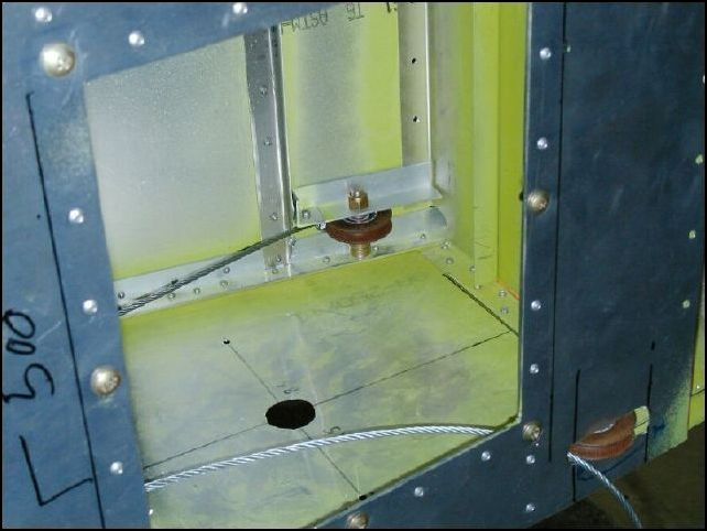 I also installed pulleys at the rear of the fuselage where the cables exit the fuselage.  This will keep the cable from rubbing on the sides of the fuselage.  I will make a bracket that will bolt around the pulley to keep the cable from jumping out of the pulley