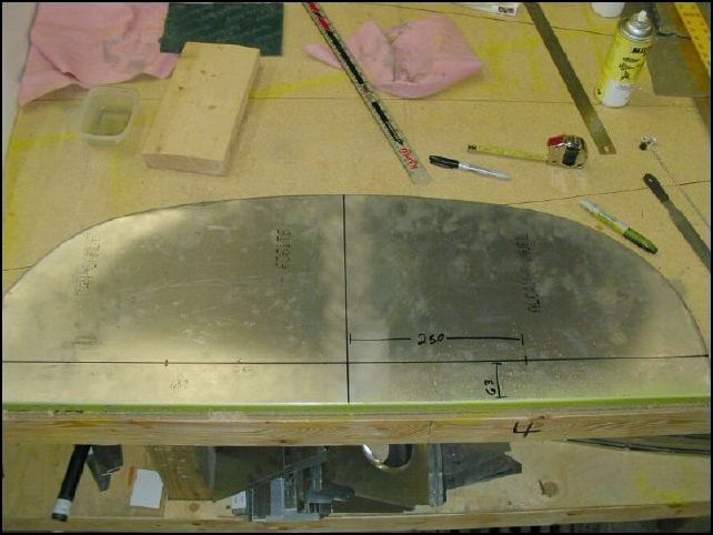 Mark center line on instrument panel.  Measure 250 mm from center line left and right and 63 mm up from bottom.  This is the location of the holes for your control yoke rods. 