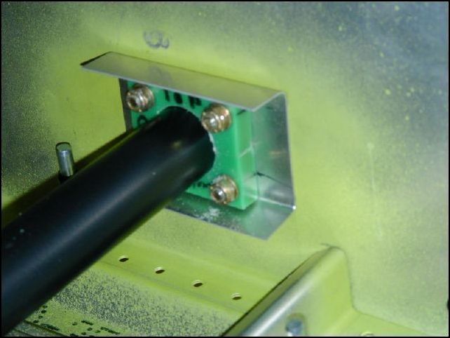 I forgot to take a few pictures, however you need to assemble the control rod slide bearings.  Slide the larger one on the control rod, then insert the smaller one in the end and rivet it in place.  Then slide the outside control rod over that one, instert it's end bearing and rivet it in place.  Now install the instrument panel.  File the bearing on the instrument panel until the control rod slides freely.