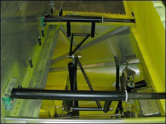 Bolt the control arms to the control rods to complete the assembly.