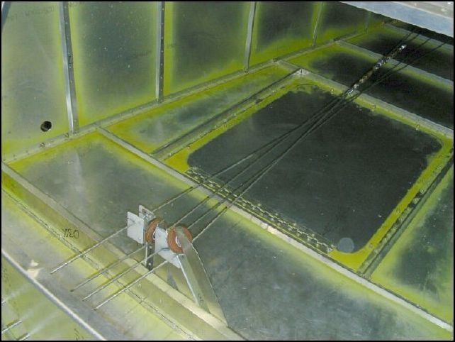 This image shows the control cables passing through the pulley assembly.