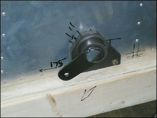 Install 20-C-15-3 (flap lever short) through the pilots side flap control bearing.