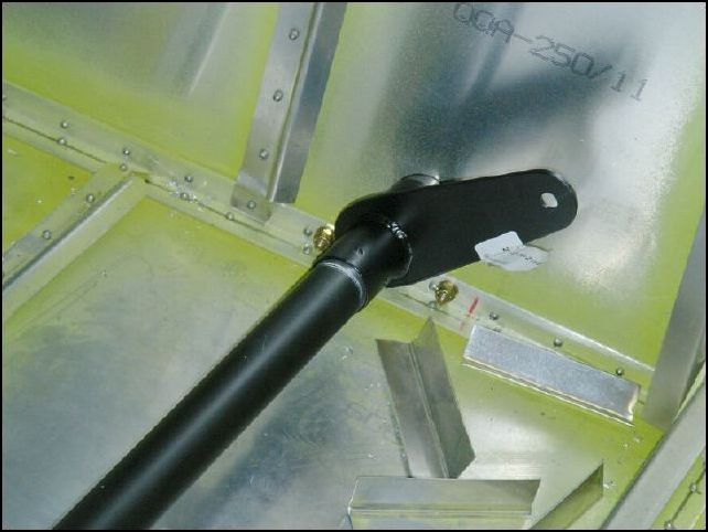 Install 20-C-15-2 (flap sector) between the short and long flap levers.  By the way, what the heck is a flap sector?  I'd just call it a flap arm or something like that.