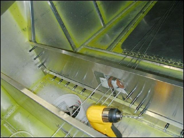 Position the rear seat rear support to the rear of the rear spar.  WOW, that is a lot of rears <grin>.  This should overlap the rear spar by 20 mm and the top should be 280mm from the floor.  Drill and cleco A5 P30 to the rear spar and spar uprights.  I also drilled rivet holes in the pulley assembly to help stiffen the assembly.