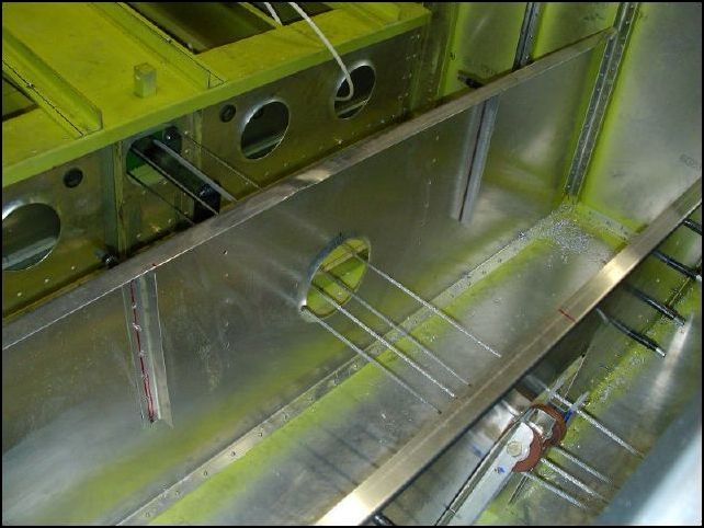 Position the other two Ls to the back of the front seat support, again with 490 mm between the angles.  Drill and cleco.