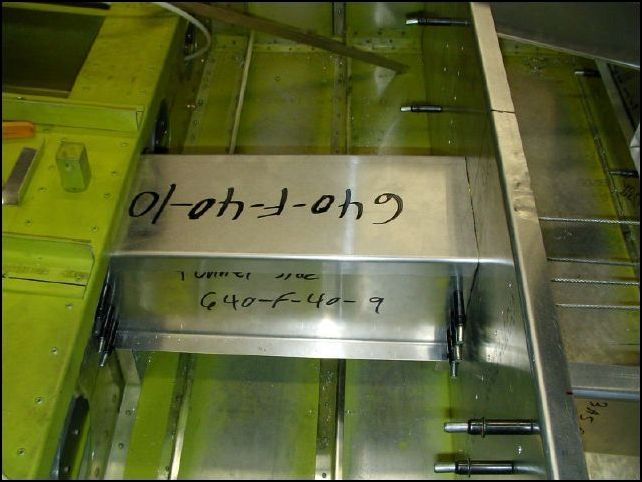 Trim 640-F-40-10 (tunnel top) to fit between the main spar and seat front.  Since the control cables pass inside the tunnel, you may want to install rivnuts in the top of the tunnel sides.