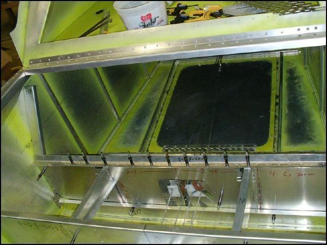 Trim 640-F-40-7 (lower seat back angle) to fit between the fuselage side skins.  Drill and cleco in position.