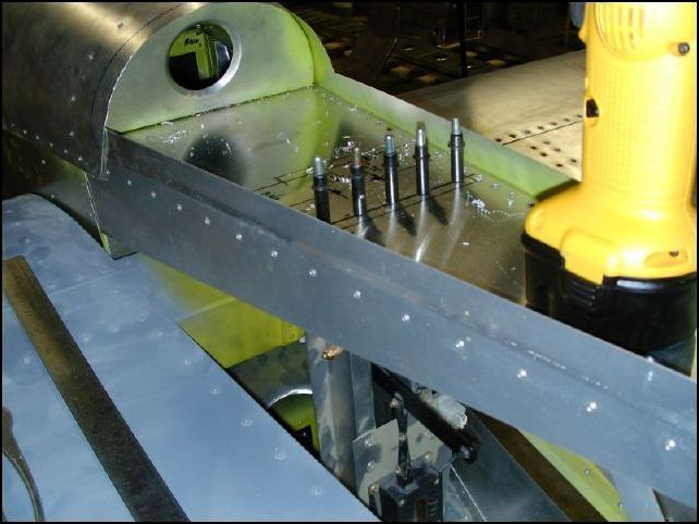 Position the electric trim assembly to the fuselage.  Drill and cleco the top Ls A5 P30