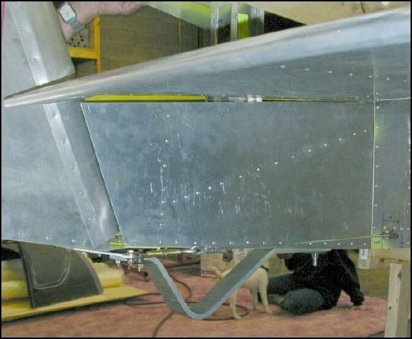 Deburr, clean, prime, and rivet the rear fuselage side skins.