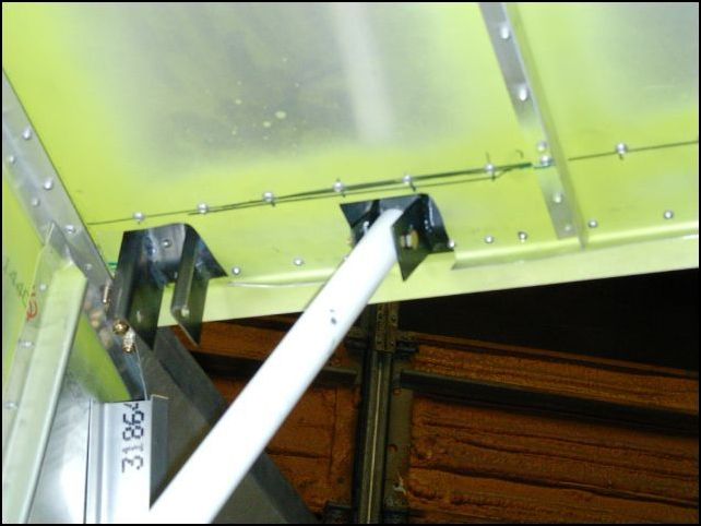 Now re-install the baggage area and slide the steps through the bottom of the fuselage and bolt them to the pivoting brackets.  You will need to cut out the baggage area floor around the pivoting brackets.