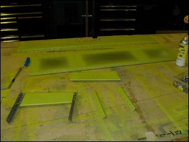 Deburr, clean, and prime the rear seat parts.