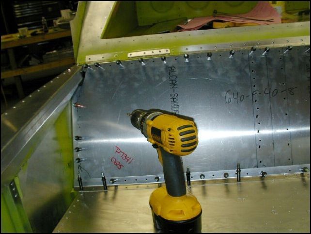 Finish drilling rivet holes for rear seat back and trim the back to fit correctly at the top.