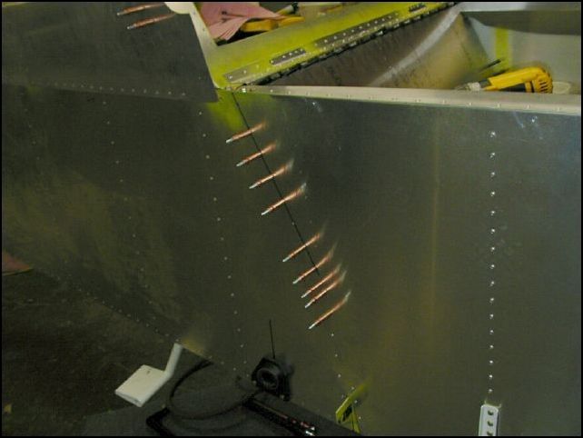 Drill and cleco the rear horizontal attachment channel (640-F-13-3) to the fuselage side skin.  A4 P40.