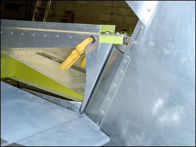 Trim rudder gap fill so that the trim fork does not rub on it and clamp it in place.