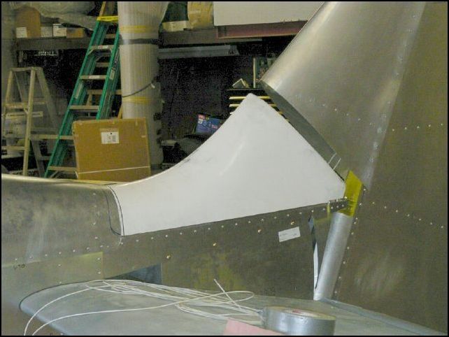 Fit tail saddle under top rear skin and over the sides down to the lip.  I HATE the huge gap between the rudder and the saddle so I will do some glass work to build up the saddle later.
