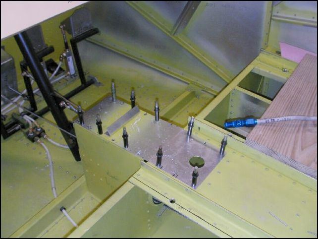 Drill and cleco torque tunnel cover to the top of the torque tunnel.  Drill hole for fuel selector.
